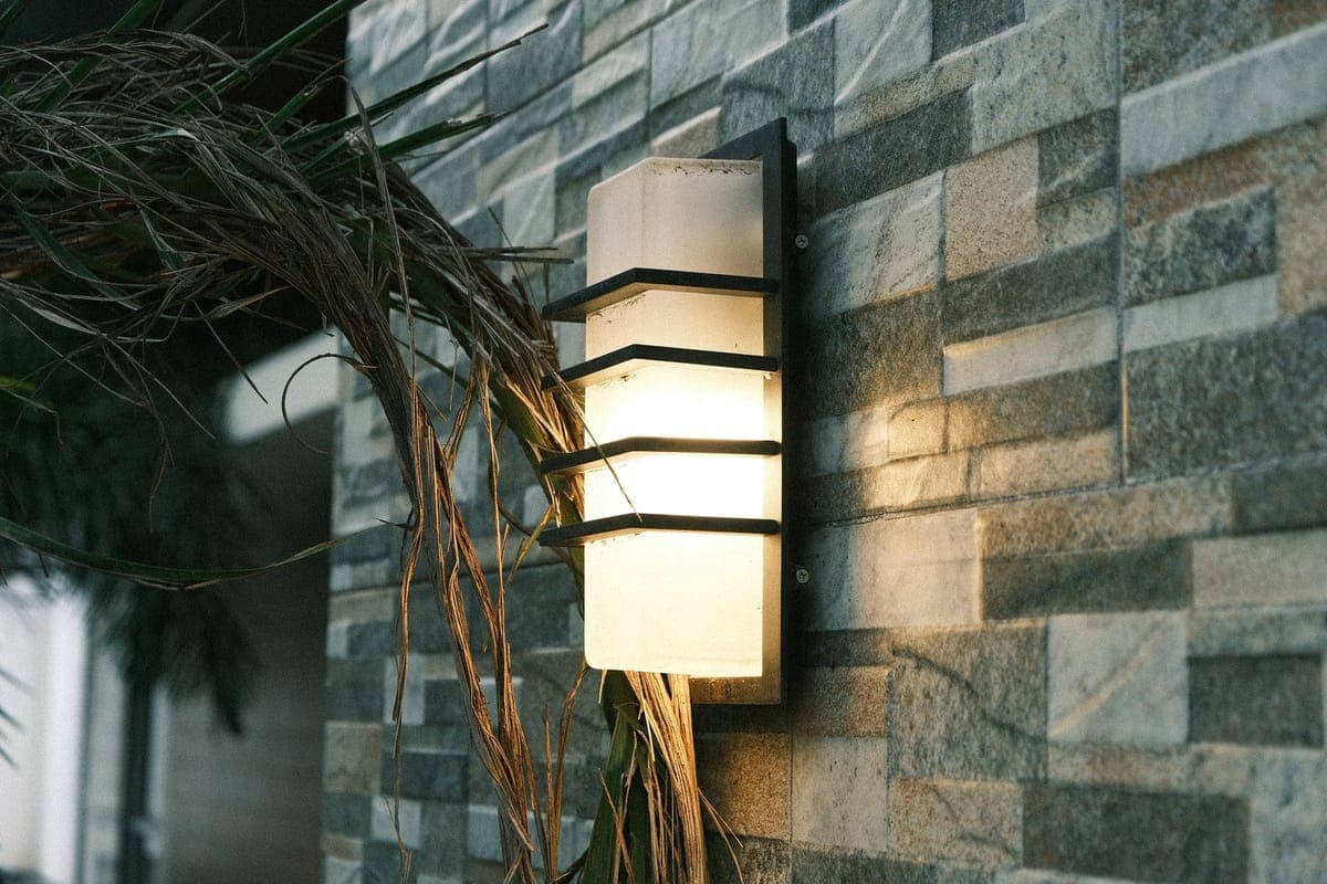 Patterned light thrown across the whole front of a house at night