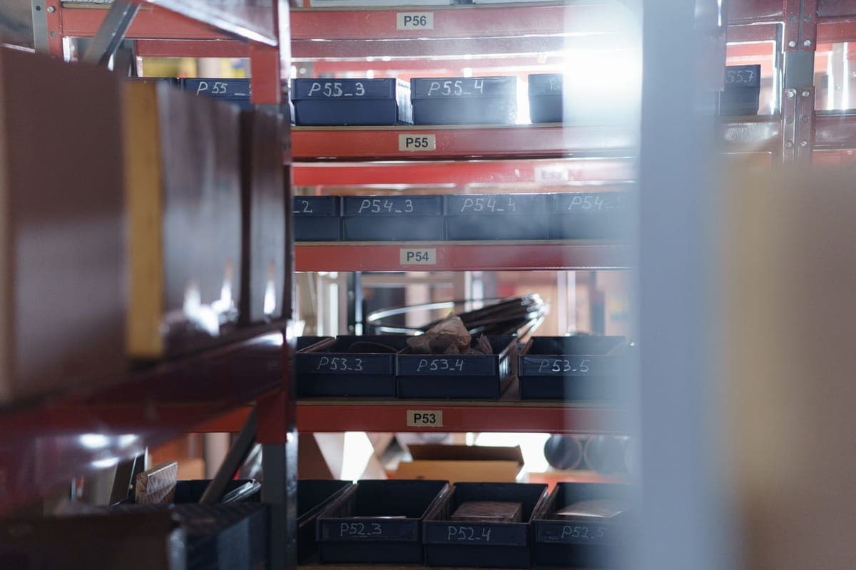 Labeled storage totes stacked neatly on garage shelving