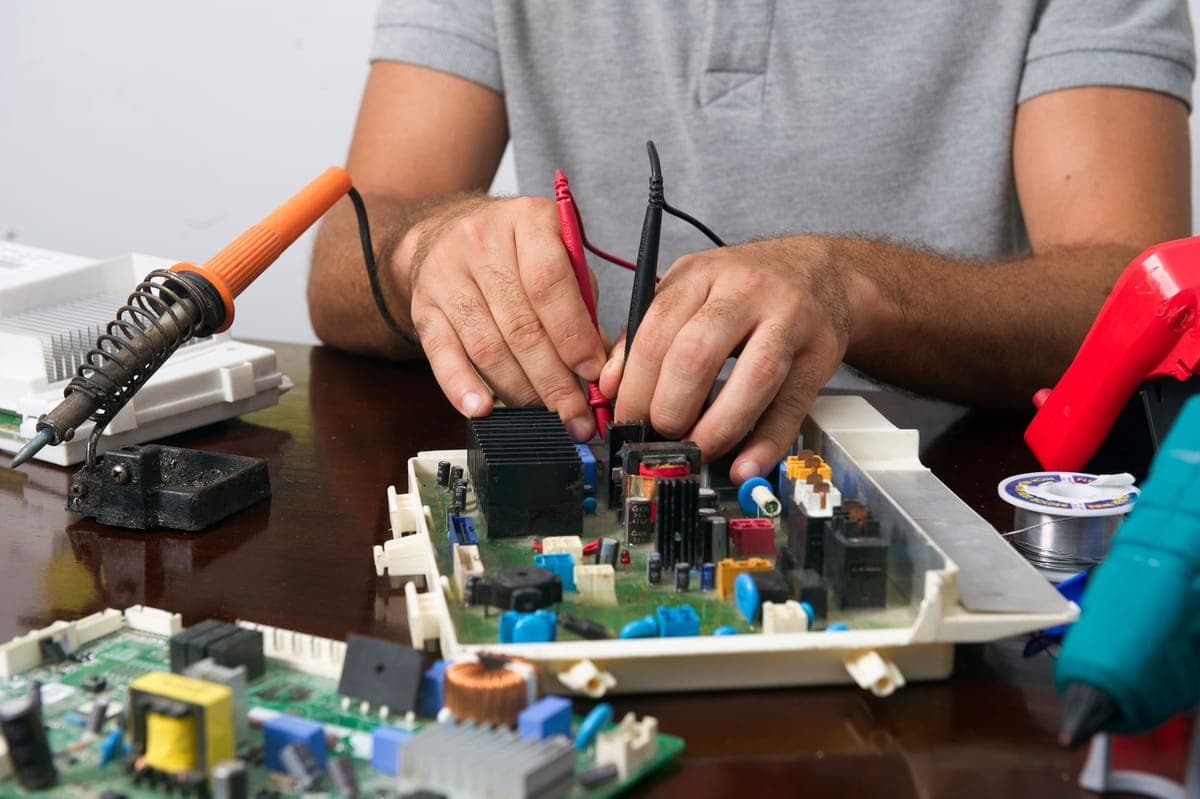 An open prop housing showing a small motor and wiring on a workbench