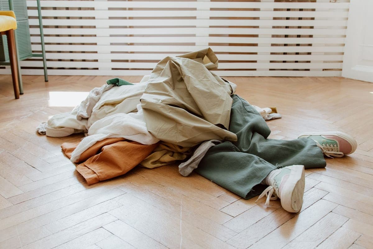 Folded inflatable fabric laid out to dry across a garage floor