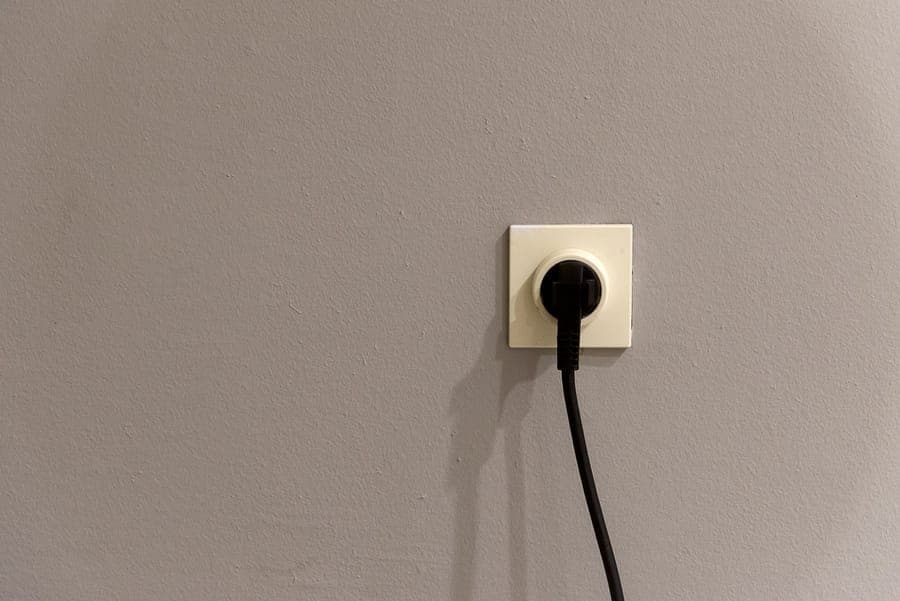 A plug-in ground-fault adapter fitted to an exterior outlet