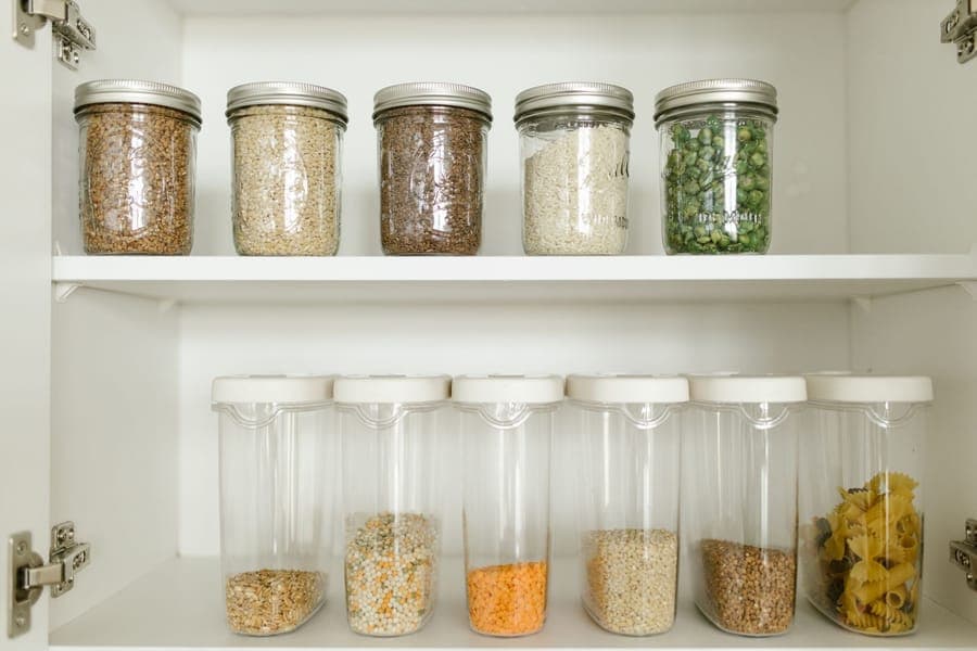 A latched storage tote with its lid clipped shut on a shelf