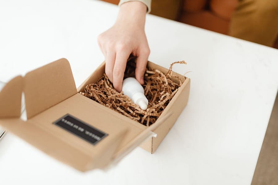 A small moisture absorber tub placed inside an open storage bin